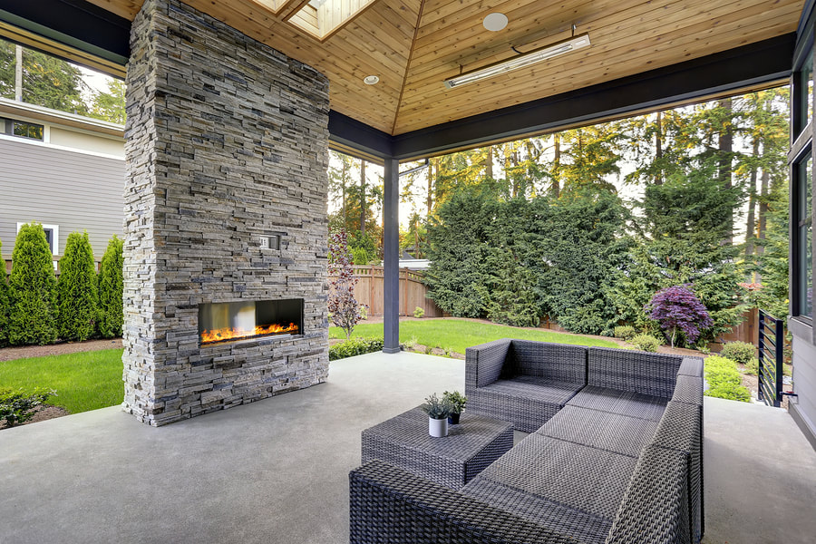 a concrete fireplace and yard